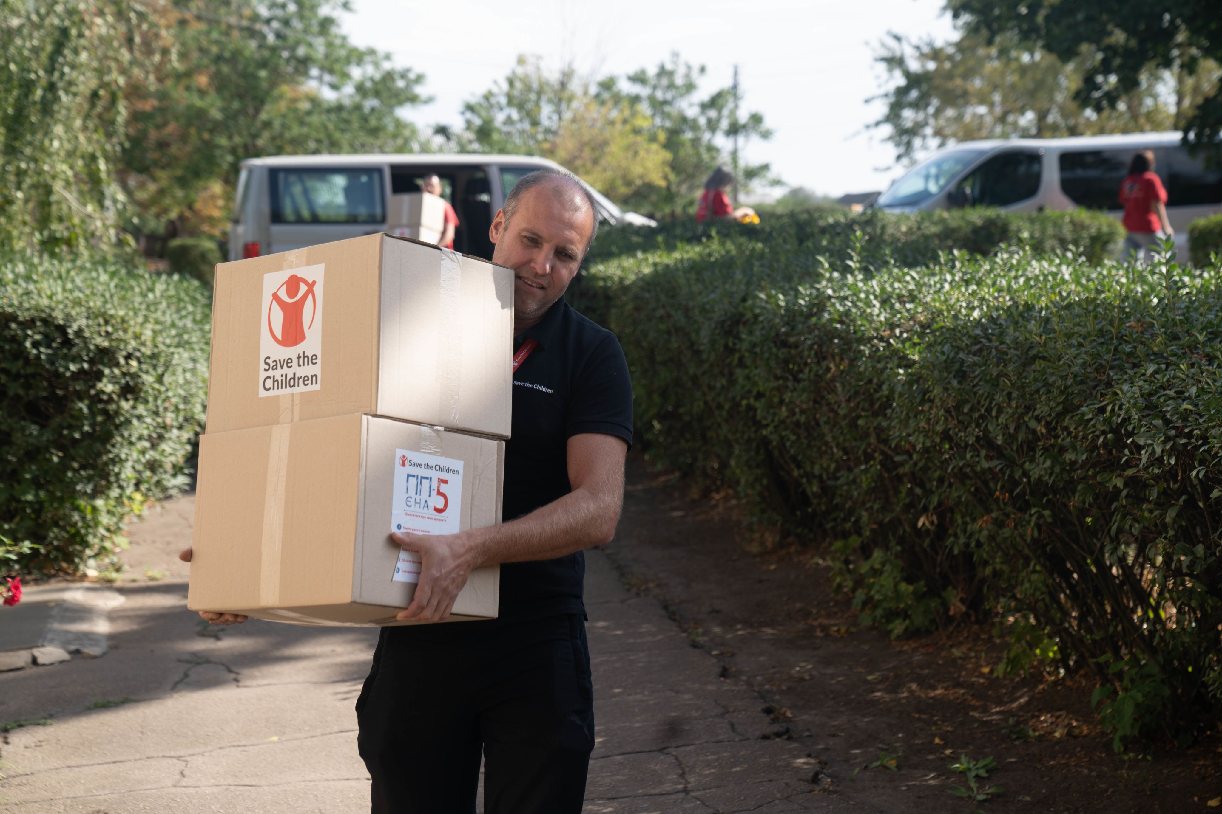Save the Children staff member unloads a truck with hygiene kits in Donetsk region, Ukraine
