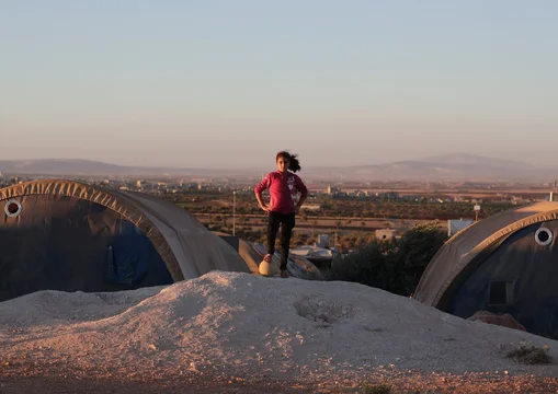 ch1732124-lujain-11-loves-playing-football-with-other-children-at-the-displacement-camp-in-syria-where-she-s-living-with-her-family_1.png