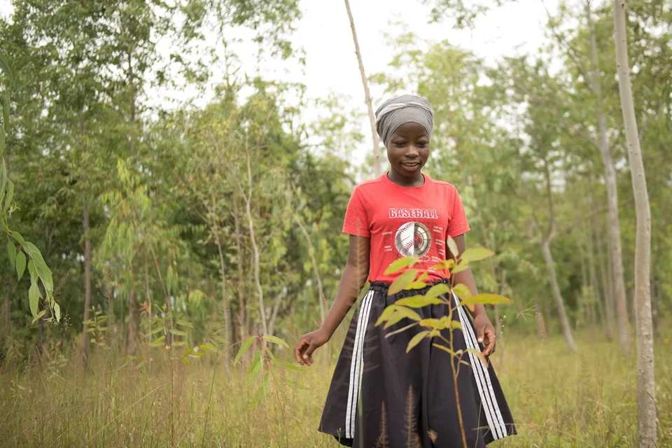 CH1683802-Esther-17-in-a-man-made-forest-where-she-has-planted-trees-near-home-Zomba-Malawi.aspx%3Fwidth%3D1200%26height%3D800%26ext%3D.jpg.webp