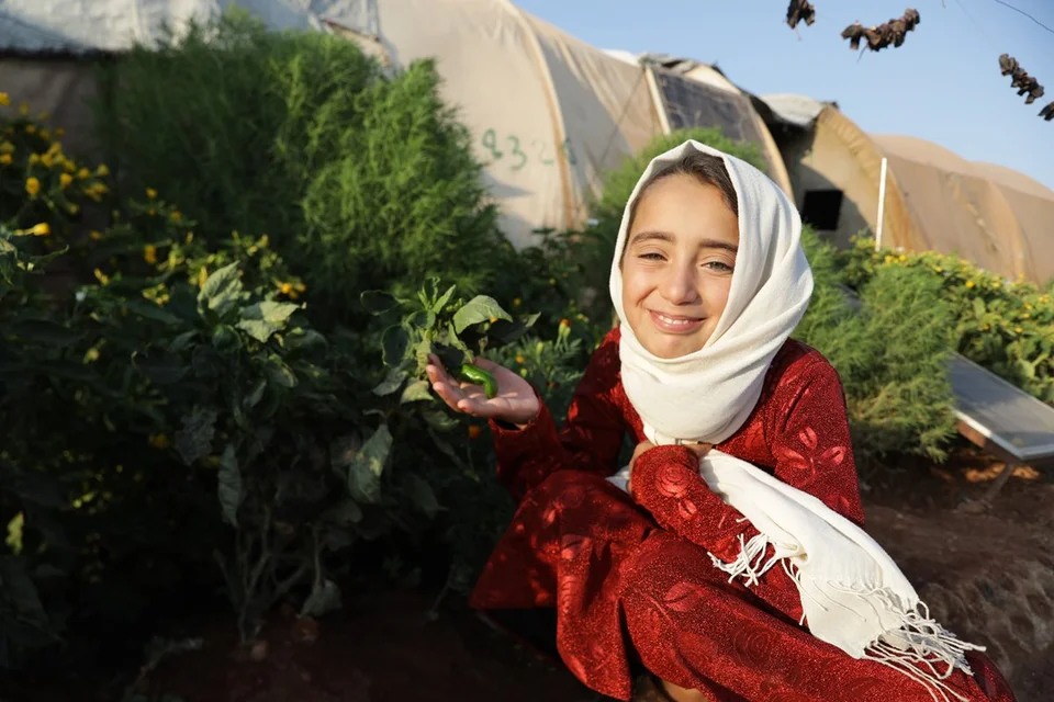 CH1731708-Iman-10-in-her-family-s-small-garden-that-s-located-in-front-of-their-tent-at-the-displacement-camp-where-they-re-living-in-Syria.aspx%3Fwidth%3D1200%26height%3D800%26ext%3D.jpg.webp