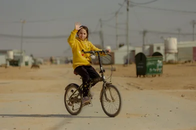 CH1796309-Jana-age-13-riding-her-bicycle-from-her-home-to-the-Coaching-for-Life-pitch.jpg CH1796309-Jana-age-13-riding-her-bicycle-from-her-home-to-the-Coaching-for-Life-pitch.jpg