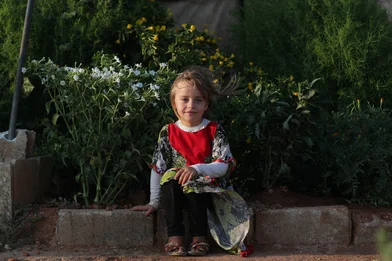 CH1731800-Abeer-6-sitting-in-front-of-her-family-s-small-garden-that-s-next-to-their-tent-at-the-displacement-camp-where-they-re-living-in-Syria.JPG CH1731800-Abeer-6-sitting-in-front-of-her-family-s-small-garden-that-s-next-to-their-tent-at-the-displacement-camp-where-they-re-living-in-Syria.JPG
