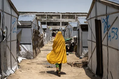 CH1727450-Miriam-16-walks-past-tents-in-a-camp-for-internally-displaced-people-in-Borno-Nigeria.jpg CH1727450-Miriam-16-walks-past-tents-in-a-camp-for-internally-displaced-people-in-Borno-Nigeria.jpg